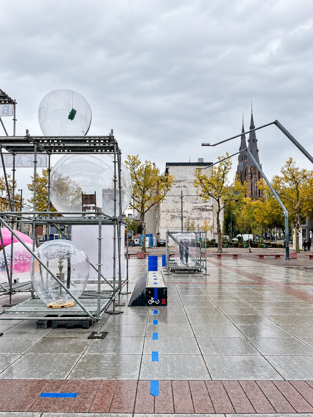 View alongside the installation’s open metal frame in the public square